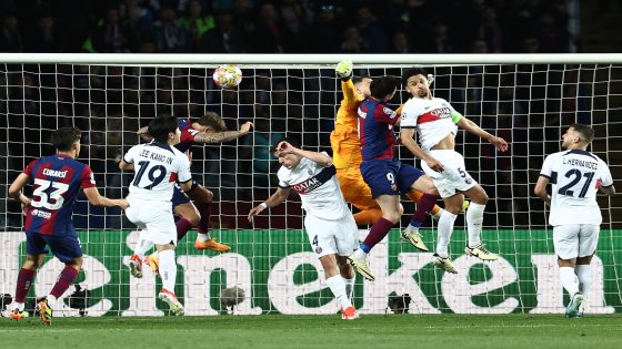Paris Saint-Germain's Italian goalkeeper #99 Gianluigi Donnarumma (C) and Barcelona's Polish forward #09 Robert Lewandowski (C,R) jump for the ball during the UEFA Champions League quarter-final second leg football match between FC Barcelona and Paris SG at the Estadi Olimpic Lluis Companys in Barcelona on April 16, 2024. (Photo by FRANCK FIFE / AFP)