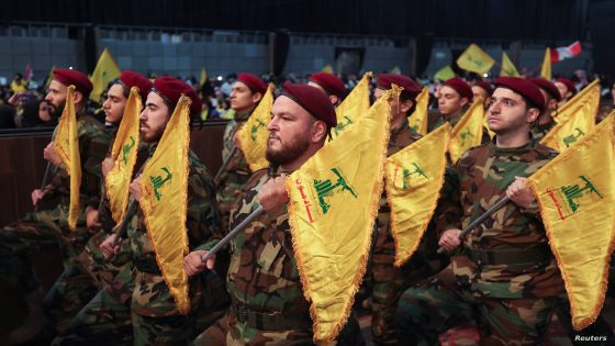 Members of Lebanon's Hezbollah hold flags during a rally commemorating the annual Hezbollah Martyrs' Day in Beirut's southern suburbs, Lebanon November 11, 2022. REUTERS/Aziz Taher