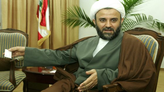 Sheikh Nabil Qawuq, Hezbollah's military chief in south Lebanon, gestures as he sits in front of a Lebanese flag in Tyre, 20 November 2006. Qawuq said today the katyusha rockets and explosives seized by the UNIFIL peacekeepers in southern Lebanon are leftovers from the previous war. UN peacekeepers policing a ceasefire between Hezbollah and Israel said over the weekend they had seized the rockets similar to those used by the Shiite militia during the summer war.
AFP PHOTO / RAMZI HAIDAR (Photo by RAMZI HAIDAR / AFP)