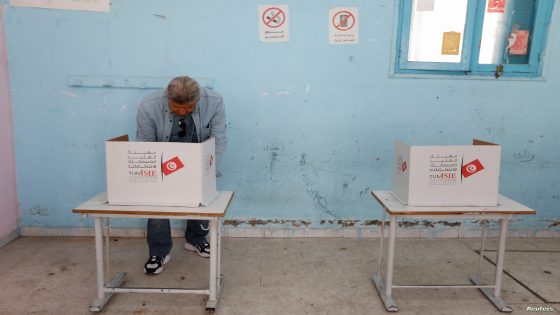 A man votes at a polling station during parliamentary election in Tunis, Tunisia December 17, 2022. REUTERS/Zoubeir Souissi