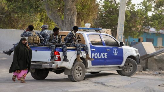 A Somali police pick-up track drives to the scene of an explosion in a restaurant often patronised by police officers, near a police training camp in Mogadishu, Somalia October 17, 2024. REUTERS/Feisal Omar