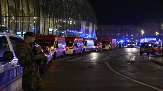 A soldier guards the train station after two trams collided, injuring dozens of people, though none critically, firefighters said, Saturday, Jan. 11, 2025 in Strasbourg, eastern France. (AP Photo/Pascal Bastien)