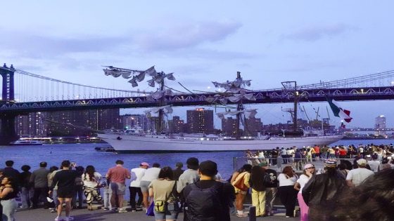 epaselect epa12111535 People look at the Cuauhtemoc, a Mexican Navy training boat, as it sits in the East River after the ship hit the Brooklyn Bridge, in New York, New York, USA, 17 May 2025. EPA/PORTER BINKS