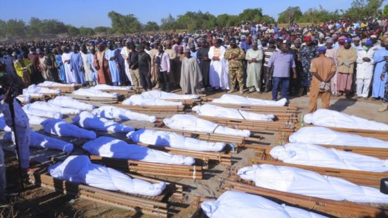 People attend a funeral for those killed by suspected Boko Haram militants in Zaabarmar, Nigeria, Sunday, Nov. 29, 2020. Nigerian officials say suspected members of the Islamic militant group Boko Haram have killed at least 40 rice farmers and fishermen while they were harvesting crops in northern Borno State. The attack was staged Saturday in a rice field in Garin Kwashebe, a Borno community known for rice farming. (AP Photo/Jossy Ola)